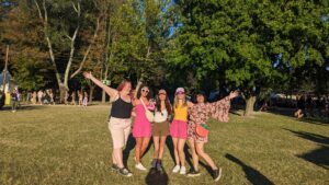 Festival Family group in daylight at Sziget with ferris wheel